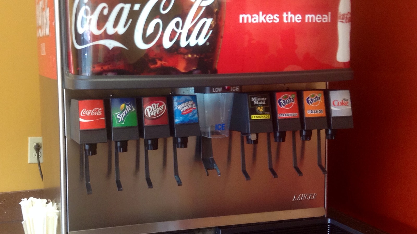 Coca-Cola fountain dispenser in a quick-service restaurant.