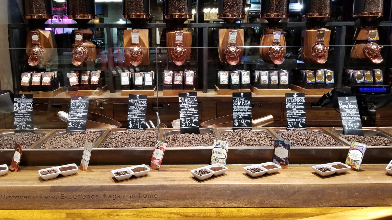 Whole coffee beans presented at Starbucks Reserve Roastery New York.
