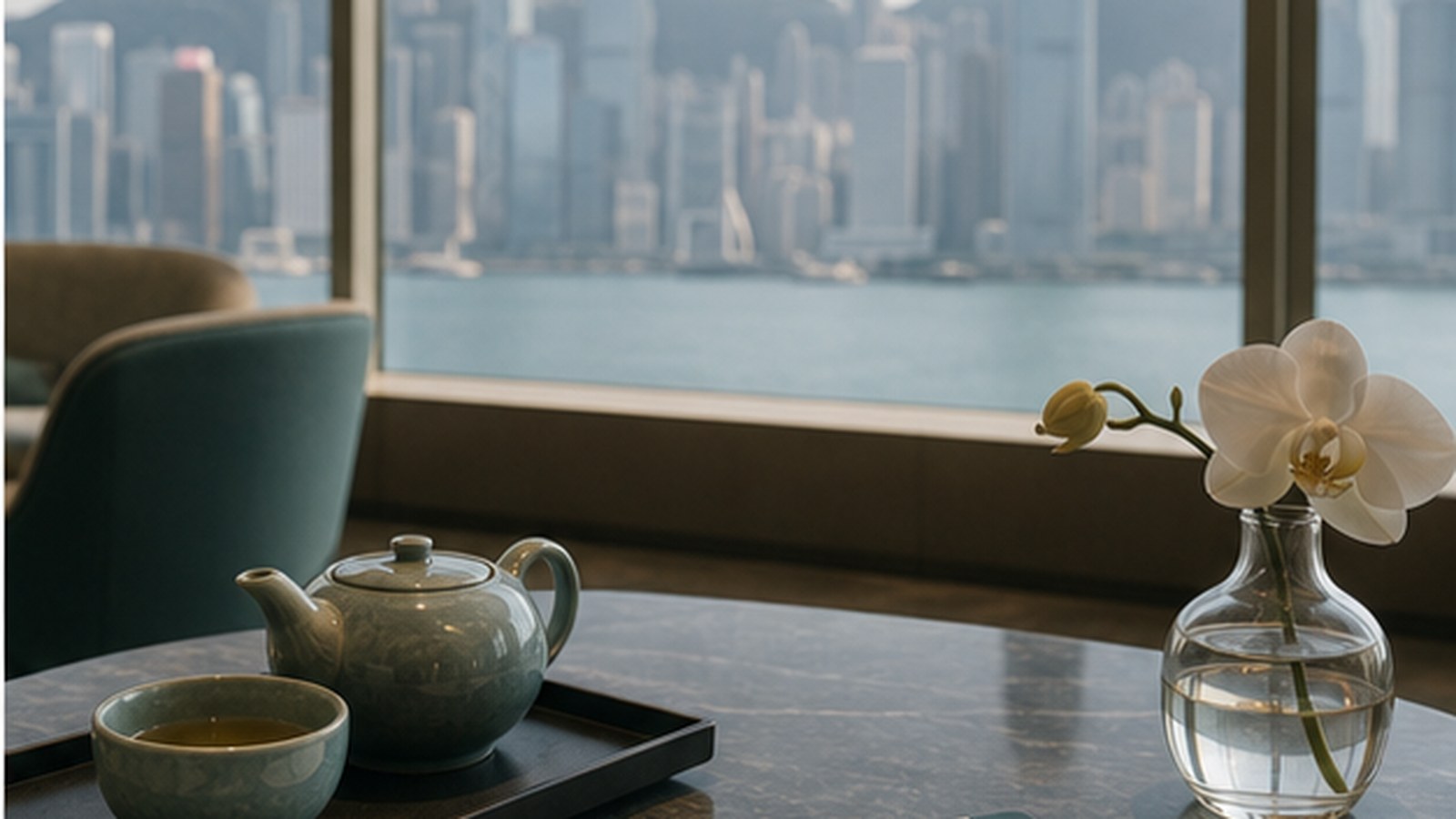 Premium tea service in an airport lounge overlooking the Hong Kong skyline.