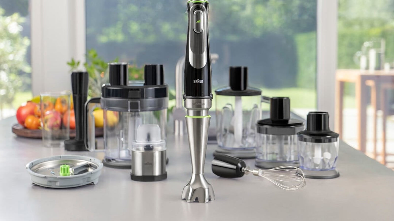 Braun hand blender set with attachments on a kitchen counter.