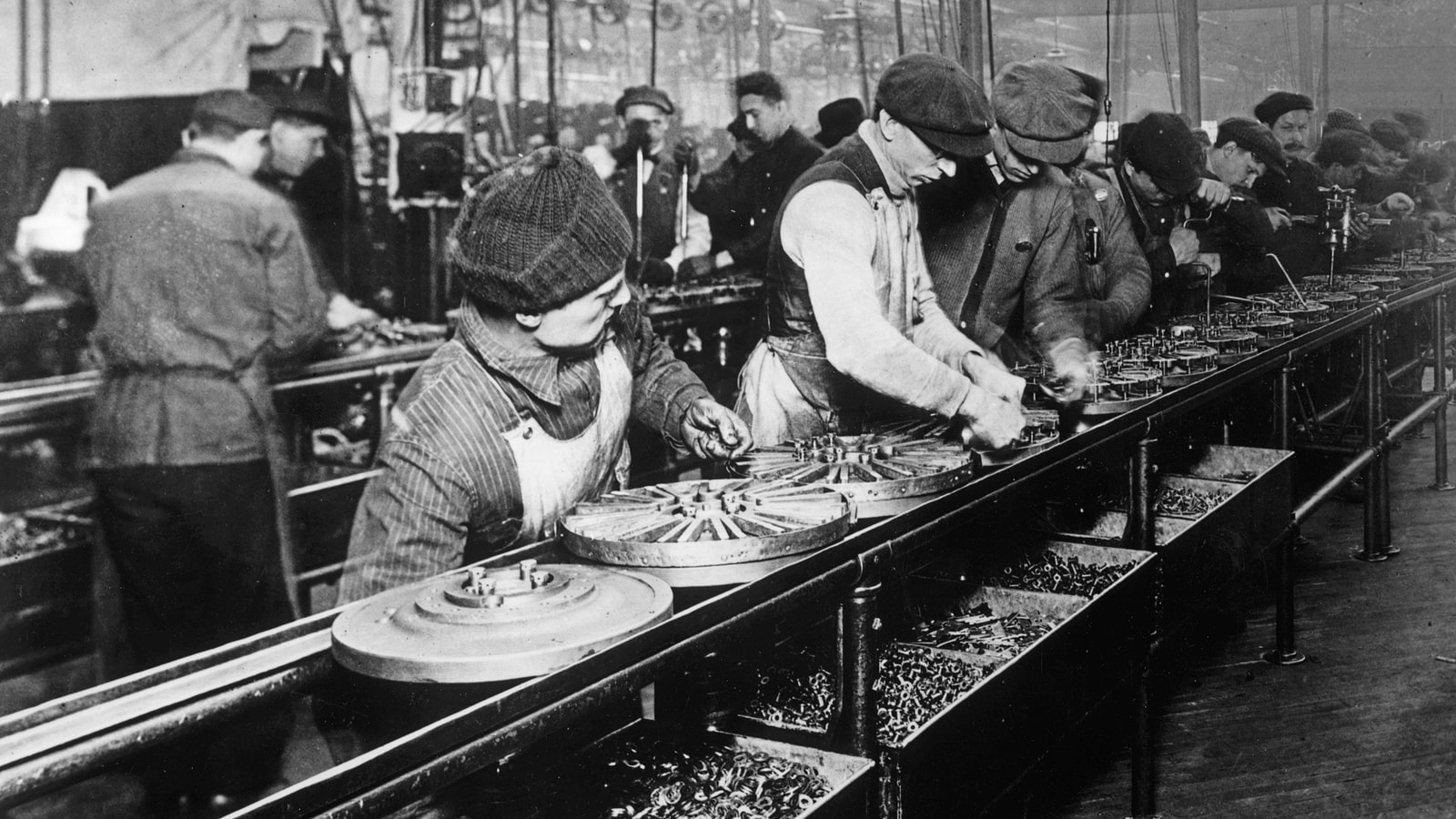 Ford assembly line in 1913 showing manufacturing scale and access proof.