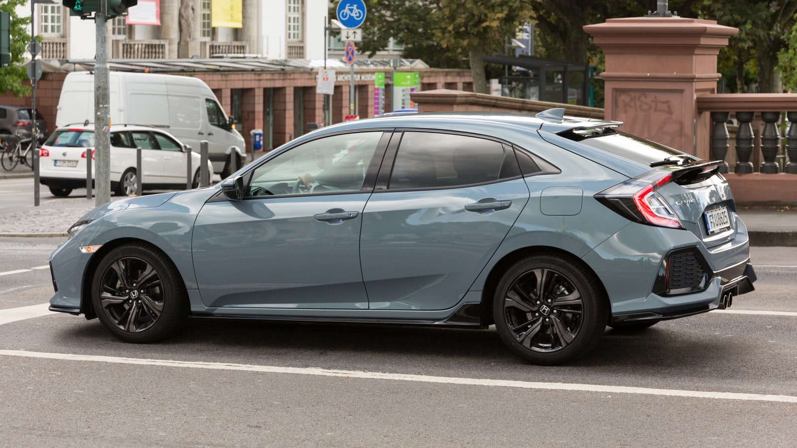 Honda Civic side profile on the street.