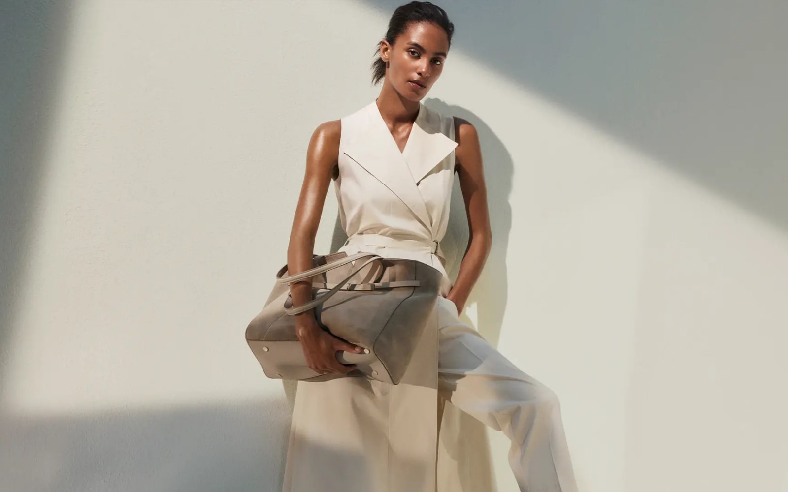 Hugo Boss campaign scene with tailored clothing and luxury apparel styling.