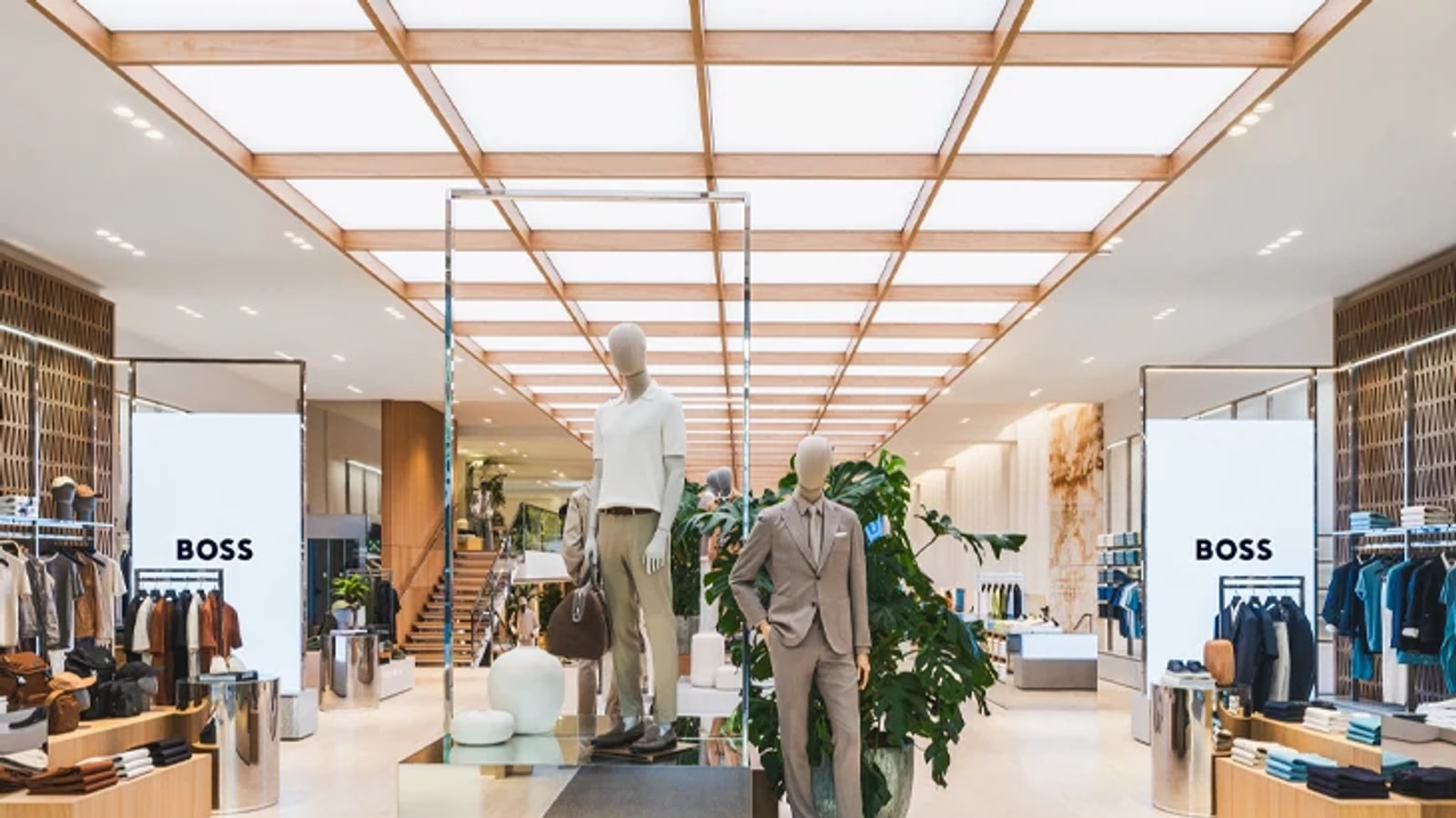 BOSS retail store interior with merchandise and brand signage.