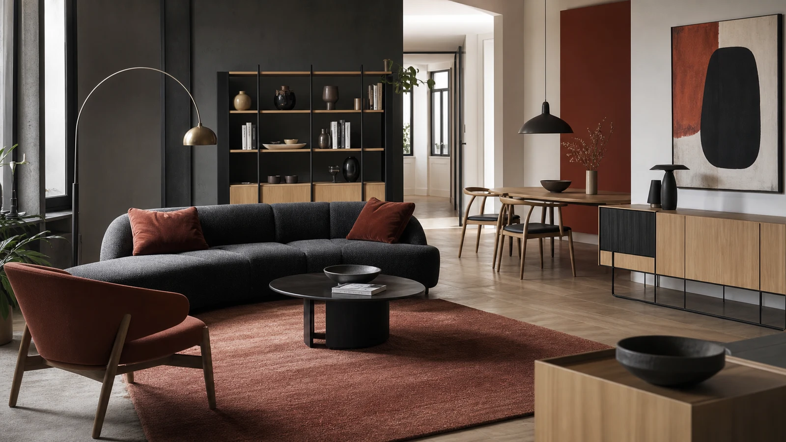 Contemporary apartment interior with coordinated sofa, chair, lighting, table, and storage furniture.