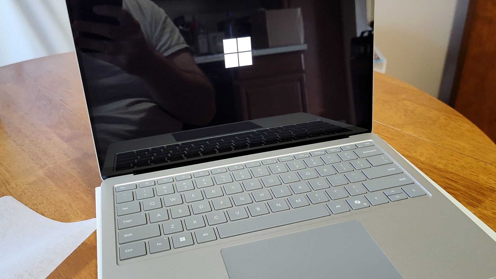 Microsoft Surface laptop with Windows mark visible on the screen.