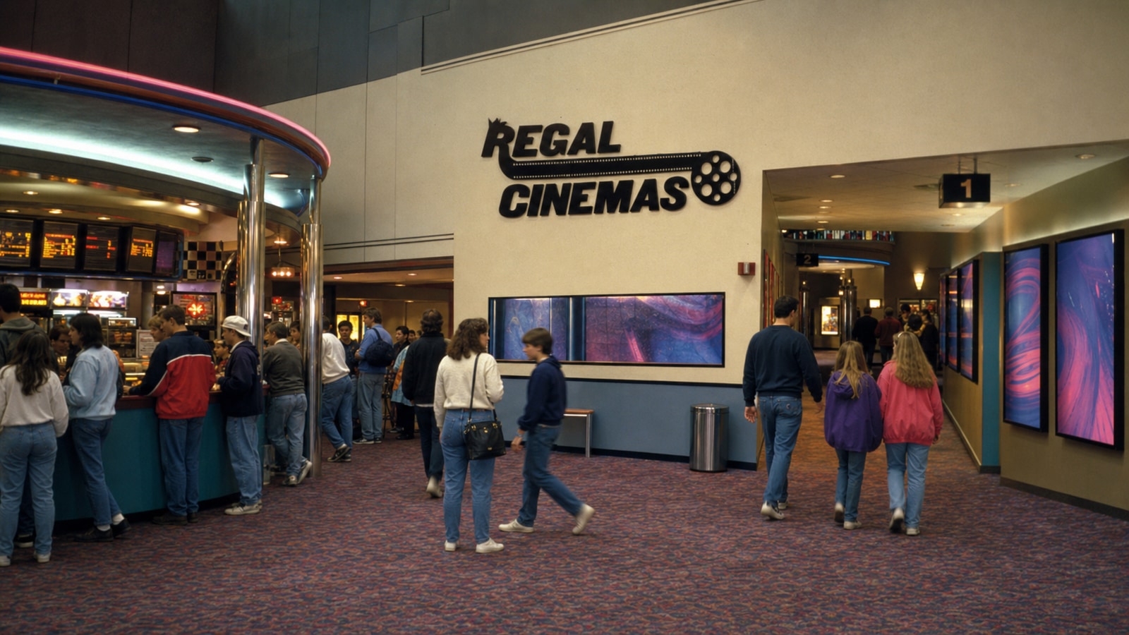 A clearly historical mid-1990s Regal Cinemas lobby with the early film-reel wordmark, concession line, and auditorium entrances.