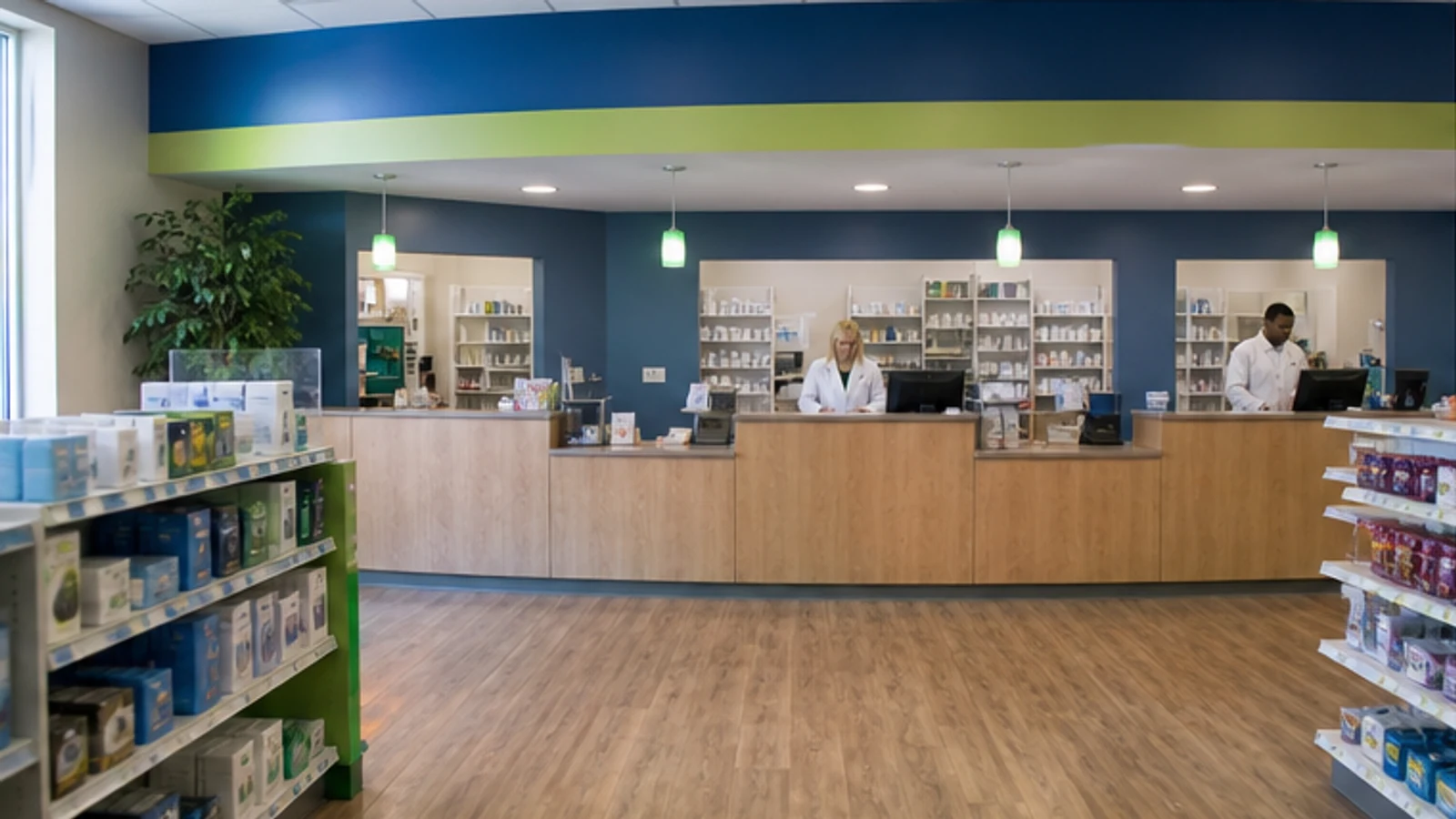 A neighborhood pharmacy counter with blue and green environmental cues.
