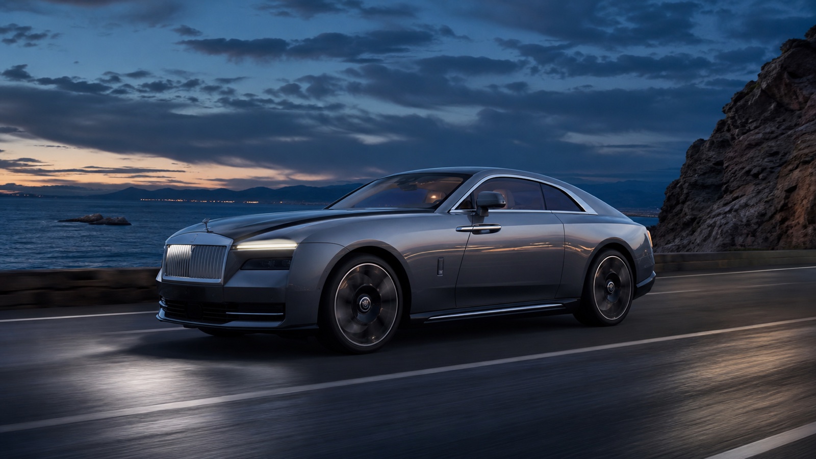 Rolls-Royce electric coupe moving silently through a dark landscape.