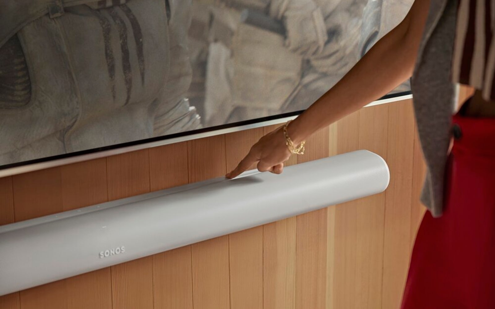 Sonos Arc Ultra soundbar in a premium home viewing room with the product mark visible.