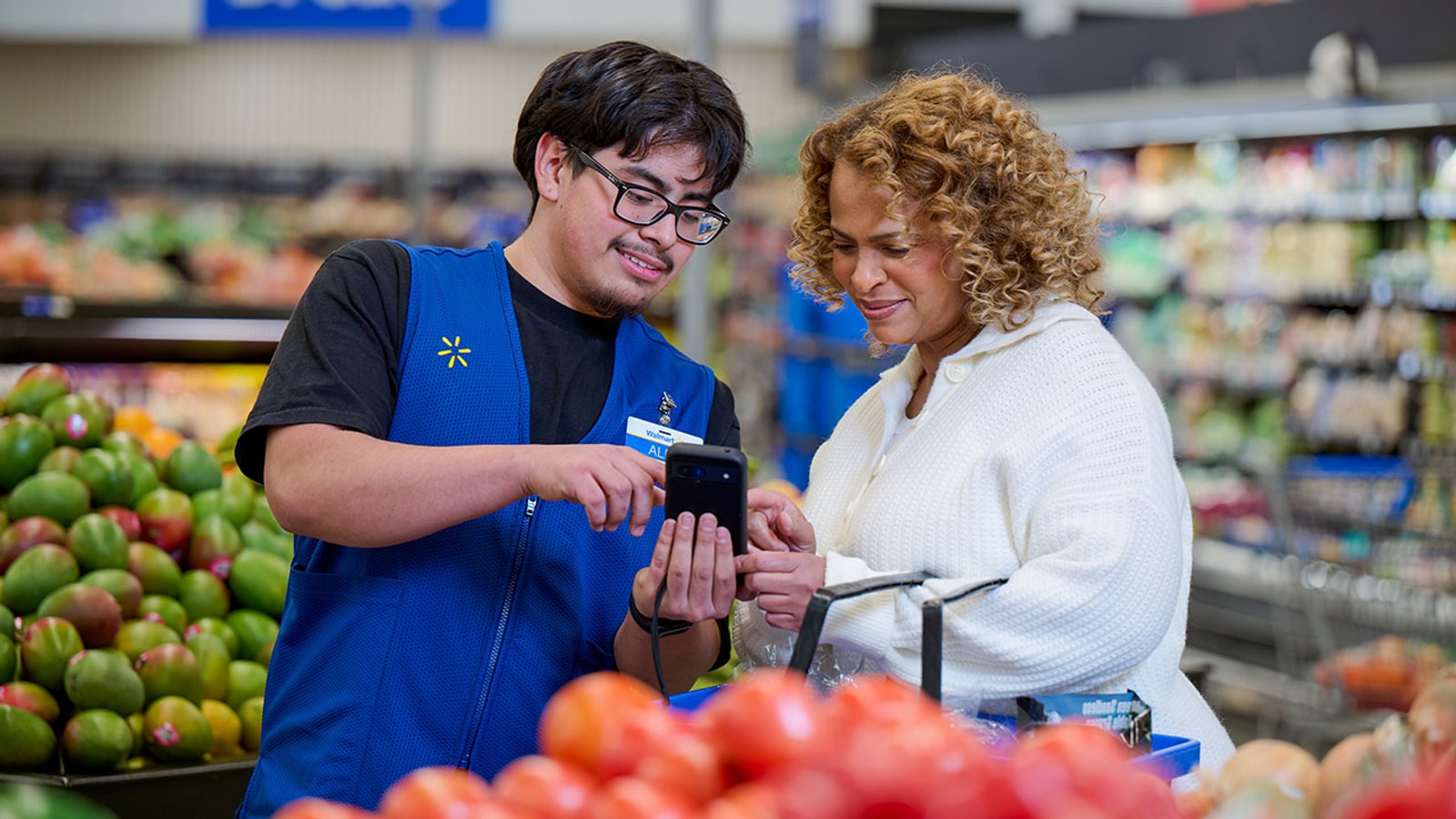 Official Walmart image of an associate helping a customer in the grocery department.