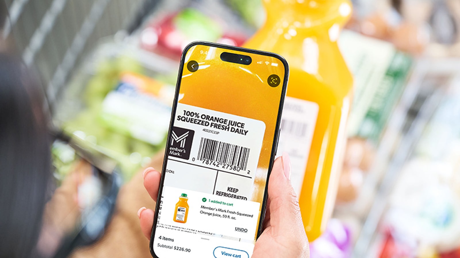 Official Walmart image showing a Sam's Club member using mobile Scan & Go.