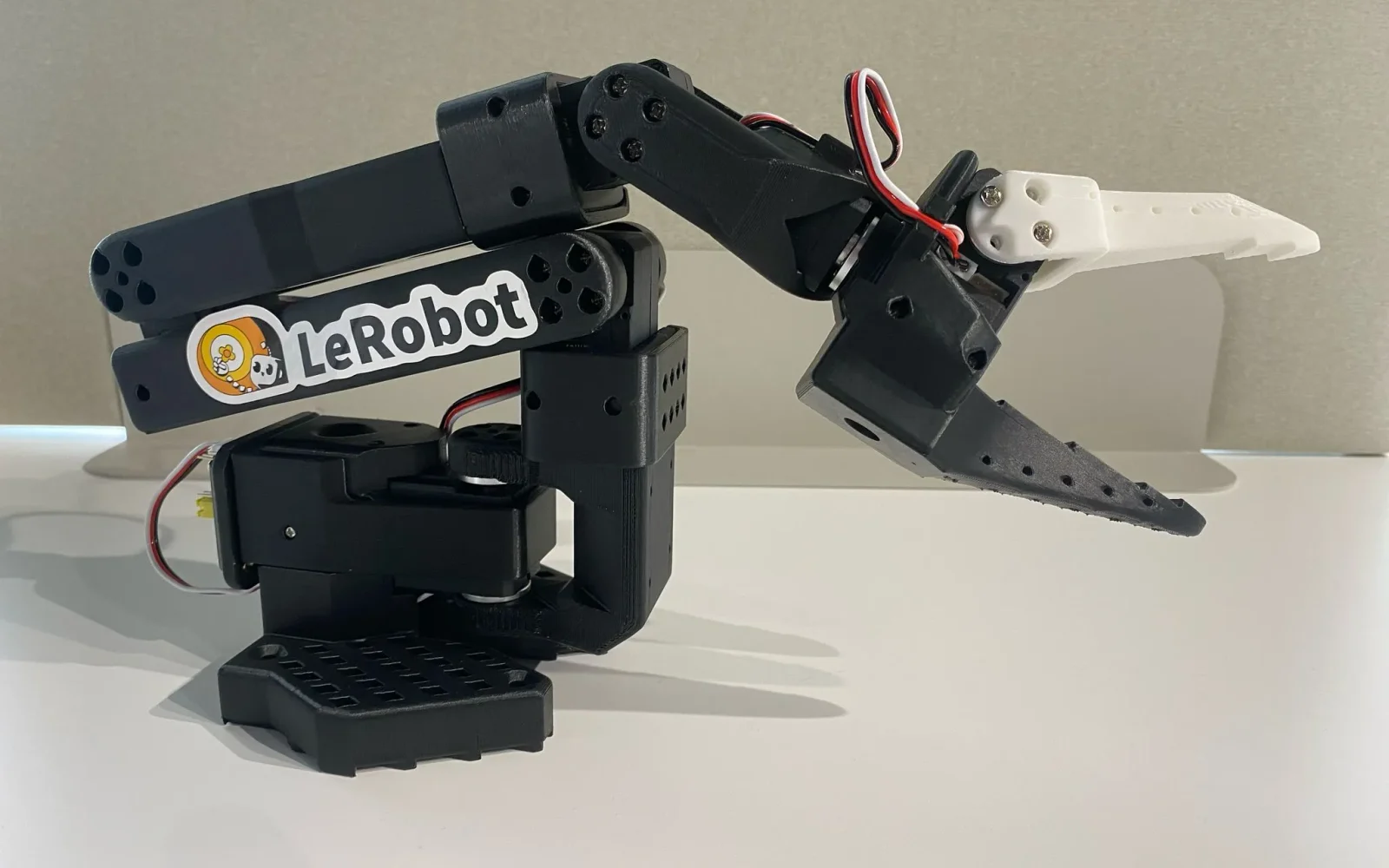 SO-101 follower robot arm with LeRobot label, pictured in Hugging Face’s official LeRobot documentation.