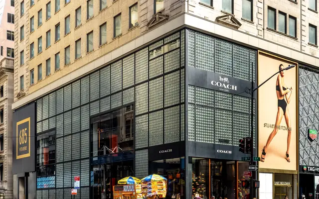 Coach House New York retail building with the Coach sign visible in a real city retail setting.