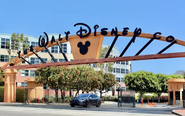 Walt Disney Studios entrance with the studio gate and company signal visible.